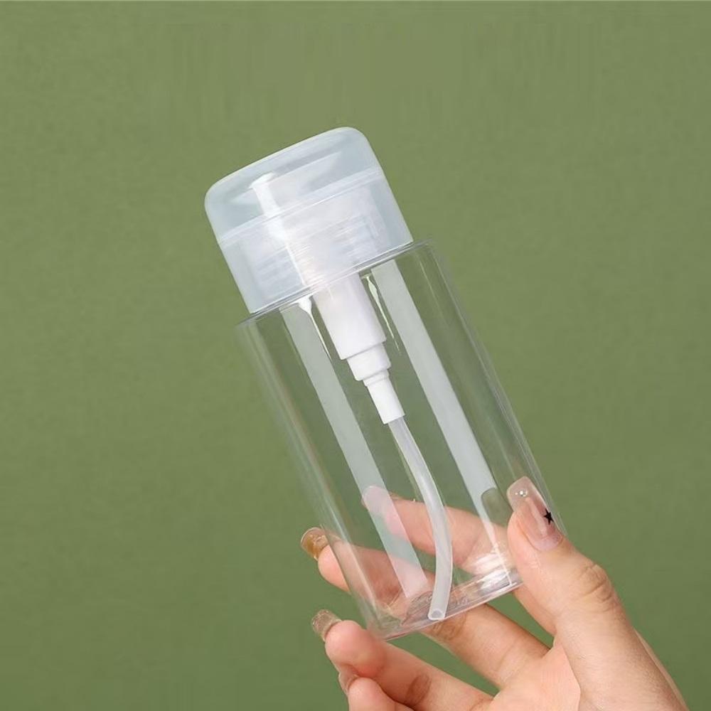 2 clear pump bottle dispensers press-down reusable travel bottle set for makeup, nail polish cleaning, cosmetics storage.