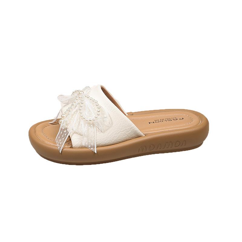 

Thick-bottomed pearl one-word female outer wear new 2025 versatile bow open-toed beach cool slippers summer fairy 40