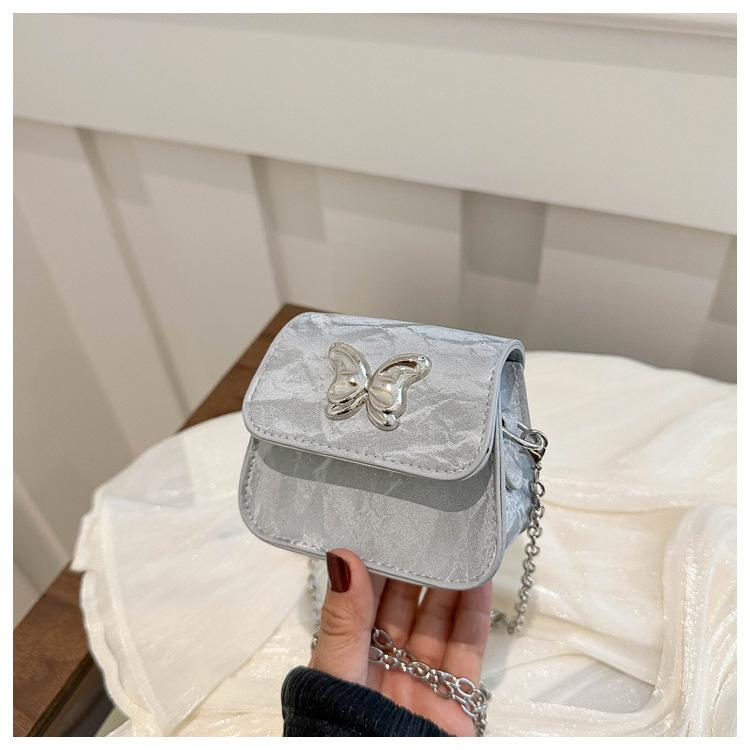 

2025 new temperament fashion design single shoulder crossbody foreign style solid color retro fresh small square texture crossbody bag серебряный