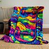 Vivid swirling patterns in rainbow colors surrounding a skateboard design. for all seasons blanket lunch break throw gift