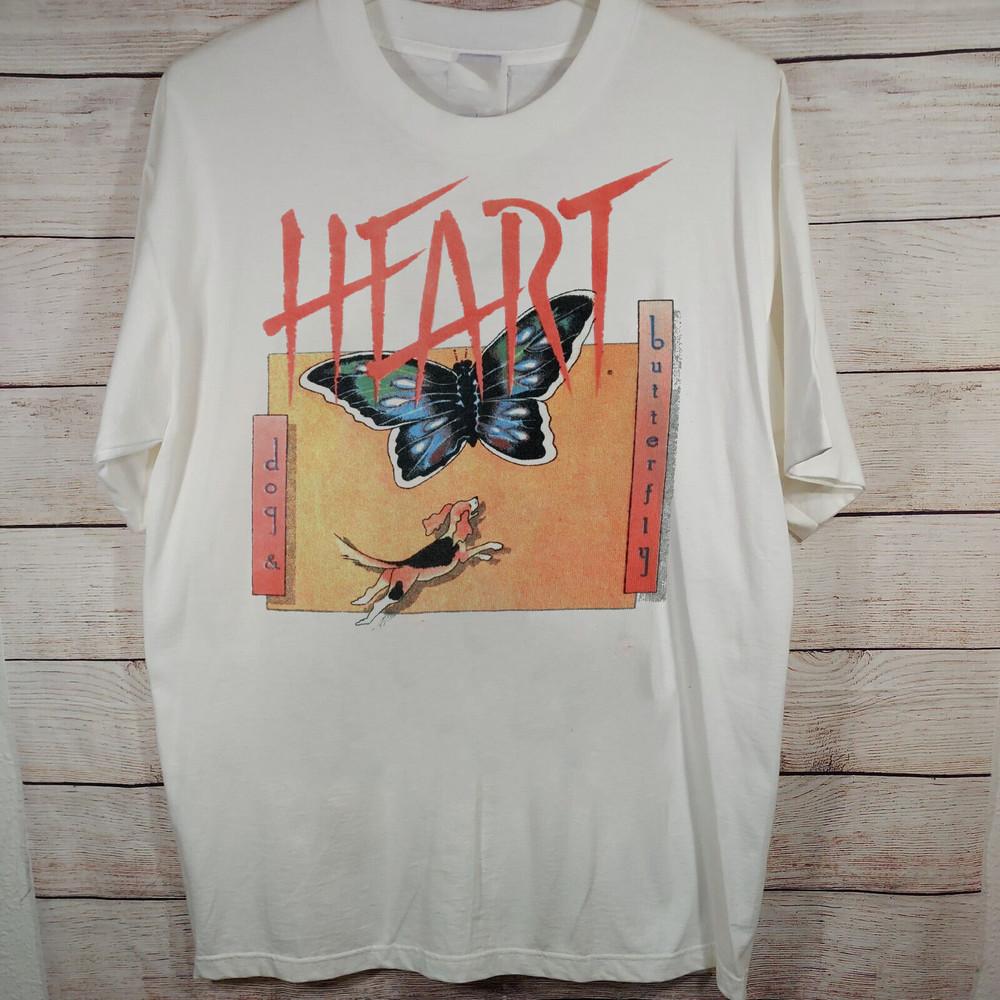 

Ann and Nancy Wilson Heart dog and butterfly Full Size S-5XL Unisex T-Shirt XXXXL