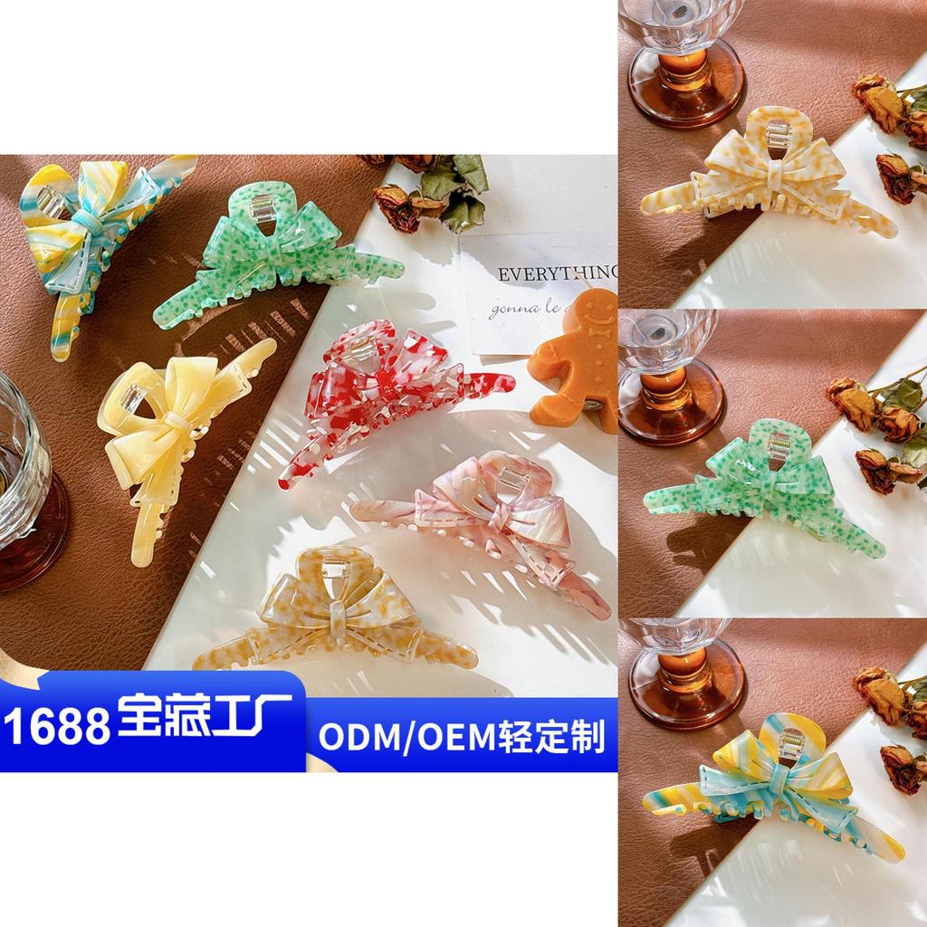 Stilvolle Acetat Haarspange mit Schleife und trendigen Streifen für fabelhafte Hochsteckfrisuren