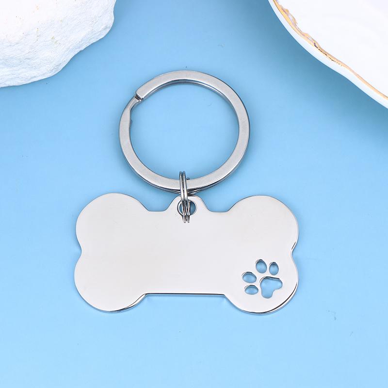 

1 шт. Брелок «Абстрактний слід лапи собаки» Бирка для ідентифікації домашніх тварин у формі кістки з текстом імені та милими символами для котів і собак срібний