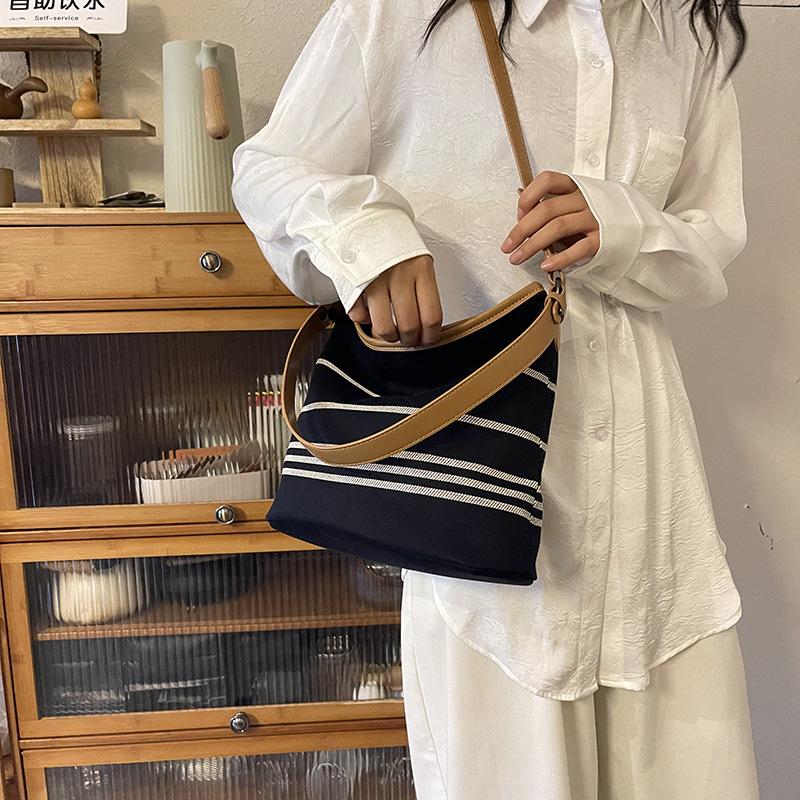 New fashion niche contrasting color striped bucket bag single shoulder oblique span trendy women's bag