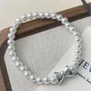 Elegant Silver Bow Pearl Bracelet: Unique and Versatile Fashion Accessory