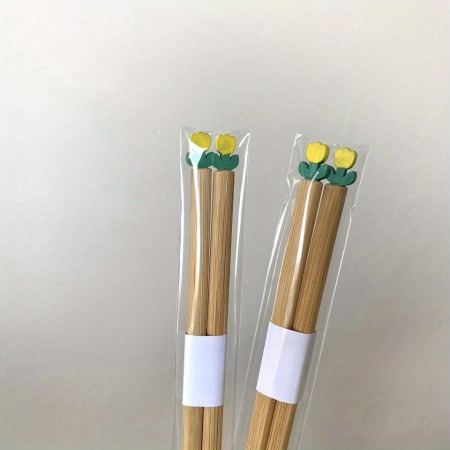 

1 пара Ins Wind Чудові тюльпани Палички для їжі Практичні бамбукові палички Палички для сімейних бенкетів для їжі Одноколірна вставка Барвисті тюльпани Декорація 1pair жовтий