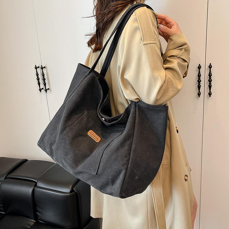 Casual large-capacity canvas bag women's bag 2025 new solid color simple tote bag fashionable shoulder armpit bag