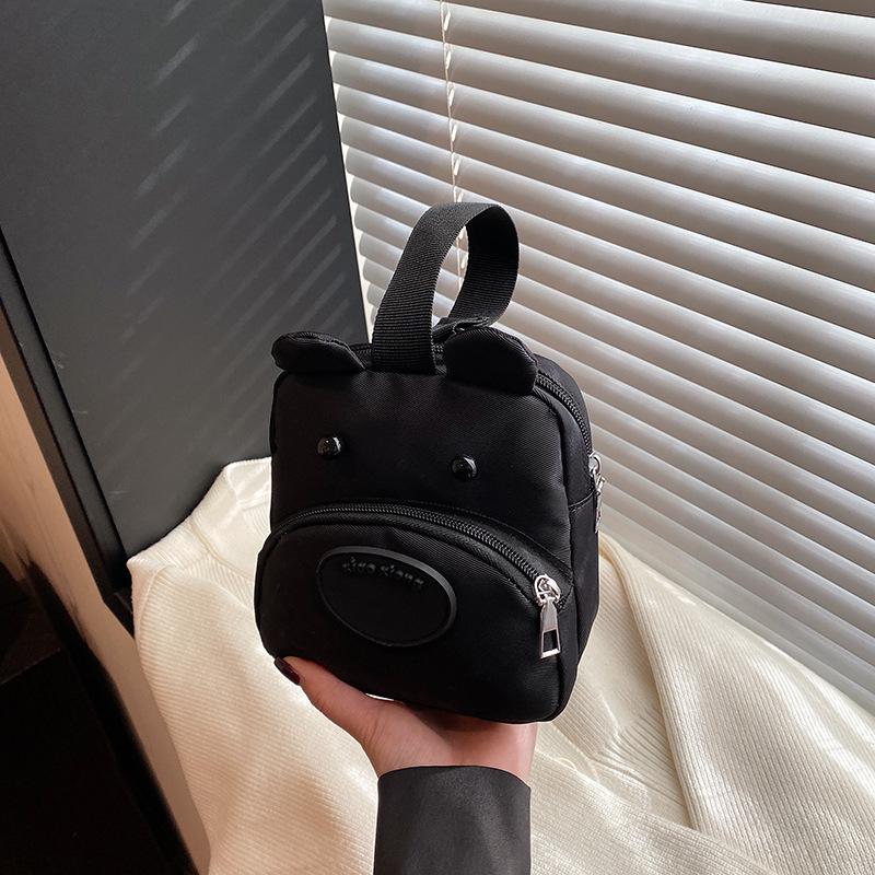 Three-color patch small bag female new dog change handbag cartoon cute student hand mobile phone bag versatile