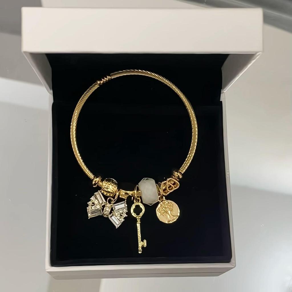 Panjia Fashion Gold Stainless Steel Bowknot Bracelet with Crystal Beads and Rhinestone Pendant.