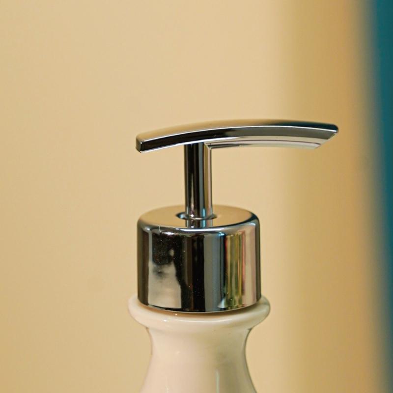 Sink Side Soap Pump Bottle with White Body and Flower Pattern for Bathroom Sink Use, Guest Bath Placement, and Hand Wash Bottle Access