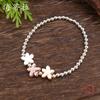 Glossy three-color flower alloy elastic bracelet, small fresh women's small flower elastic bracelet