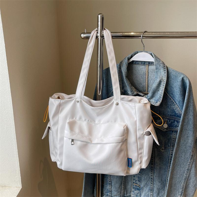 

Корейская версия простой холщовой женской сумки-тоут 2025 новая сумка женская сумка через плечо большой вместимости рюкзак сумка для мамы женская бежевый