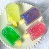 Taba Squishy Glitzer Eis am Stiel Fidget Squishes Eiscreme Fake Food Squishy Angstlöser Stressabbau Entlüftungsspielzeug Pudding Geschenk