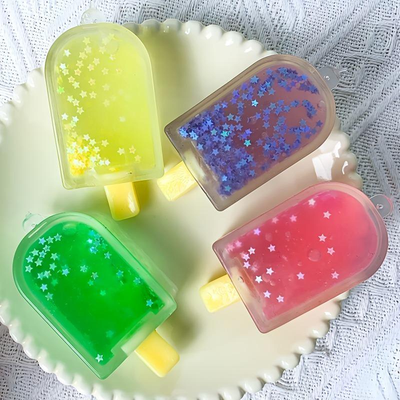 Taba Squishy Glitzer Eis am Stiel Fidget Squishes Eiscreme Fake Food Squishy Angstlöser Stressabbau Entlüftungsspielzeug Pudding Geschenk