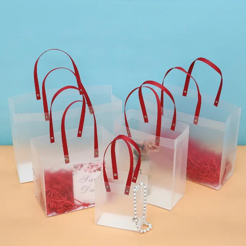 

10pcs High-quality Semitransparent Plastic Bag Frosted Bags With Paper Handle Hard Plastic Package Gift gift bag 15x13x7cm