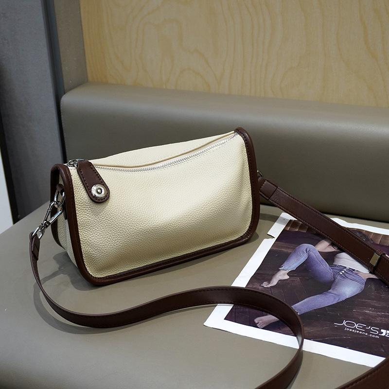 

Leather dumpling bag women s 2023 new retro commuter high-end women s bag niche single shoulder fashion messenger small bag 24CM