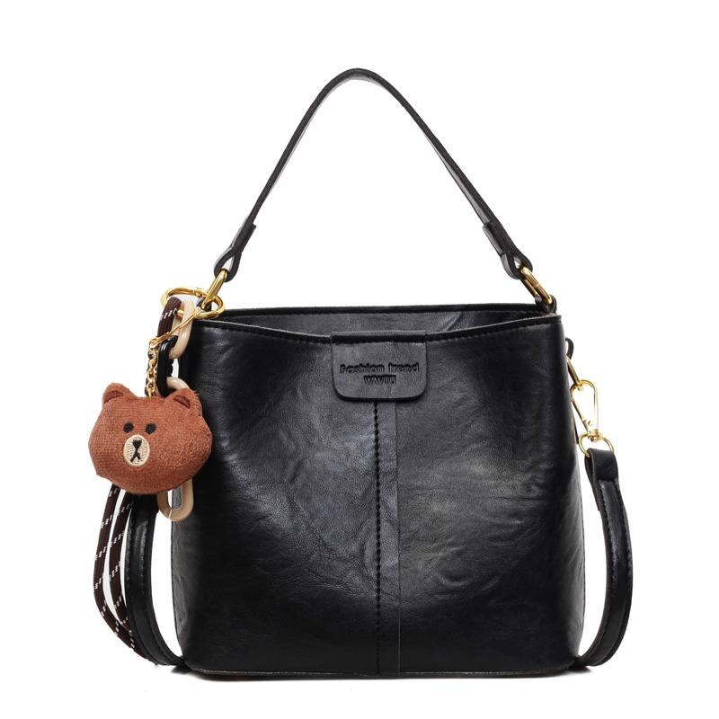 Neue trendige Mode mit Anhänger Schulter Damenhandtasche Retro Schulter Große Kapazität Breitband Umhänge Eimerhandtasche