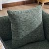 Modern single armchair with comfortable fabric backrest and two storage compartments, complemented by a practical side table.