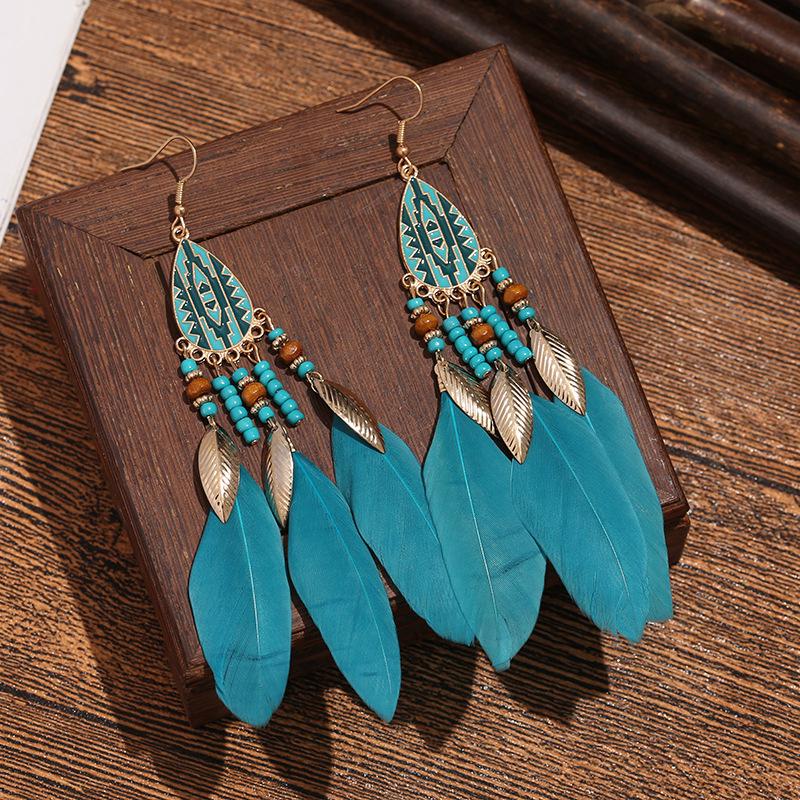 Bohemian Faux Silver Feather Tassel Mosquito Coil Earrings: Summer Retro Ethnic Ear Jewelry