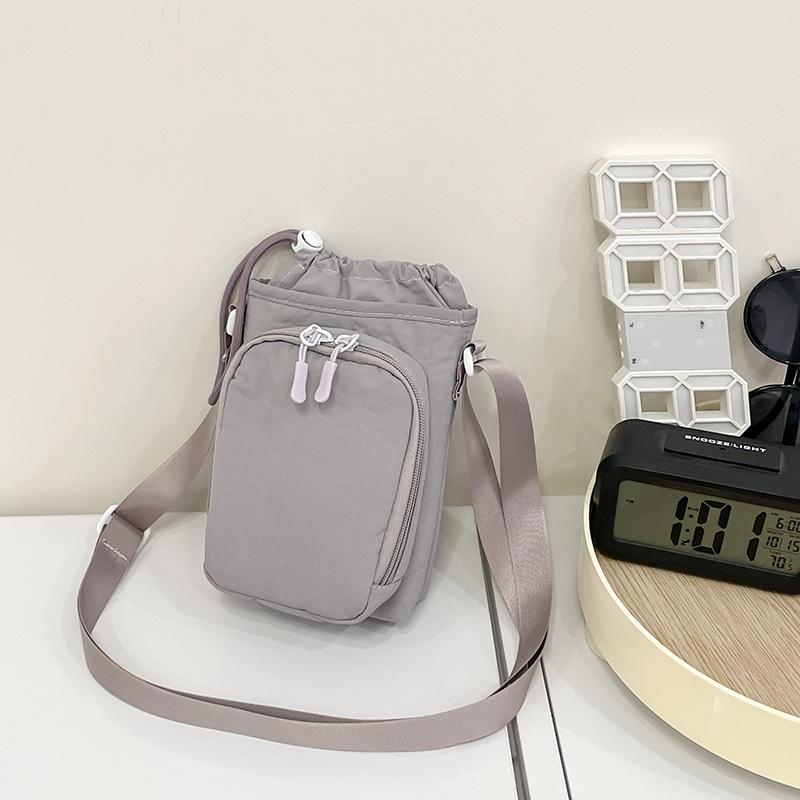 Crossbody bag women's new Korean version of simple solid color small square bag casual versatile mobile phone bag student water cup bag tide