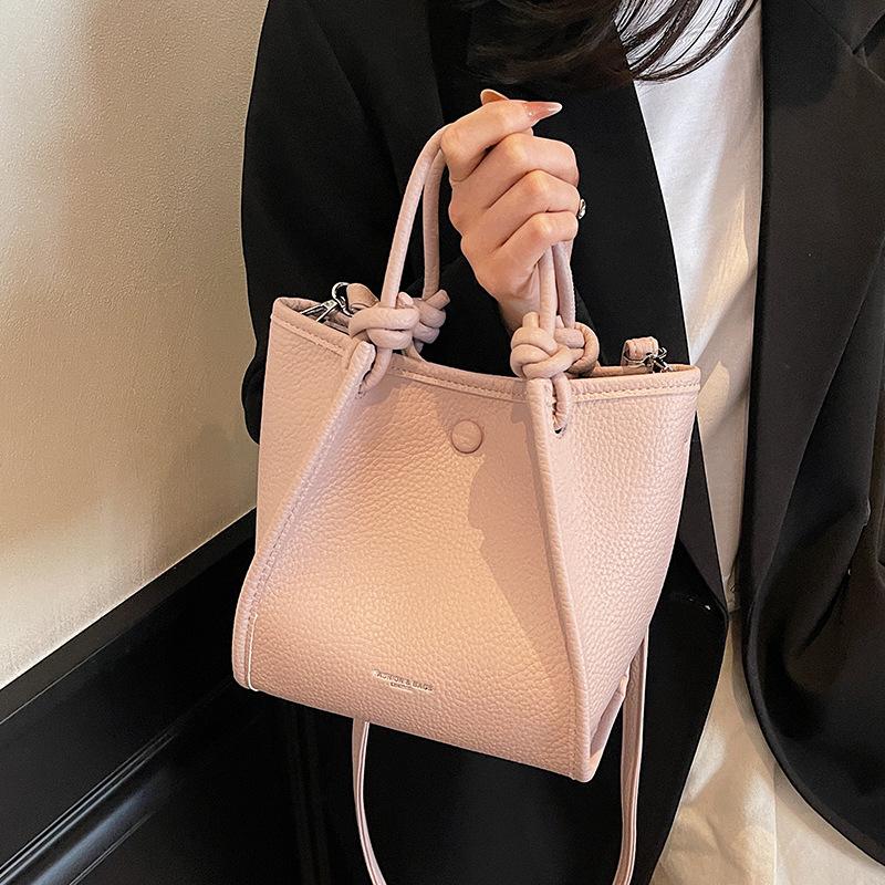 2025 spring and summer new fashion high sense simple solid color bucket bag versatile temperament women's commuter messenger bag