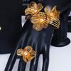 Exquisite 4-Piece Tassel Jewelry Set: Hollow Flower Necklace, Earrings, Bracelet & Ring