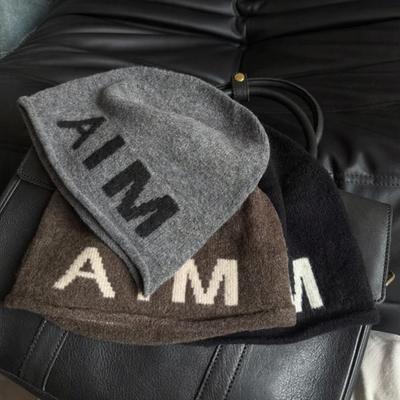 A Simple Korean Style Personalized Pile Up Hood with A Woolen Hat for Women In Autumn and Winter Featuring Ins Letters