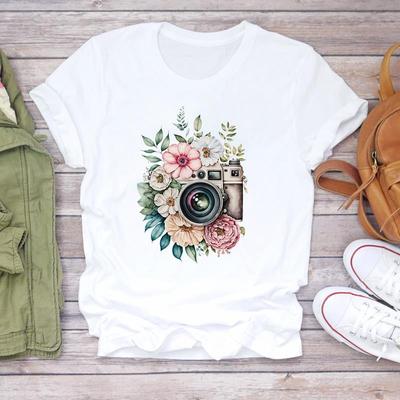 (Tamanho asiático) Camiseta feminina estampada estilo câmera flor tendência anos 90 camiseta top roupa casual manga curta feminina moda camiseta feminina gráfica