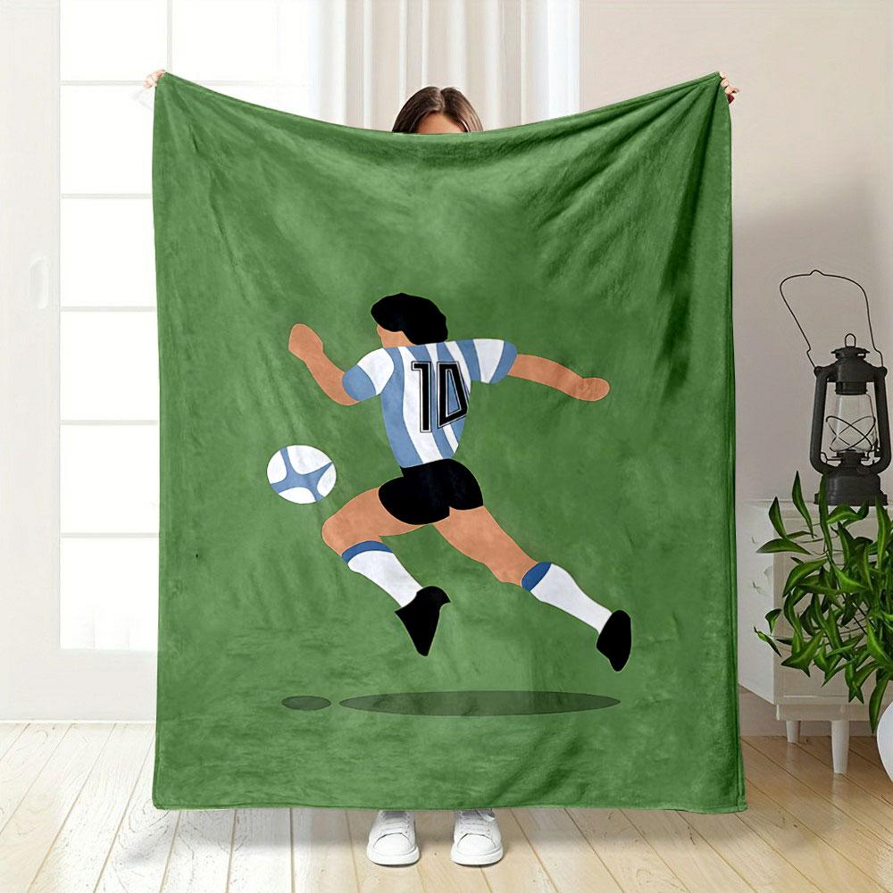Illustration of a soccer player wearing stripes chasing a ball on a green field. for all seasons blanket lunch break throw gift