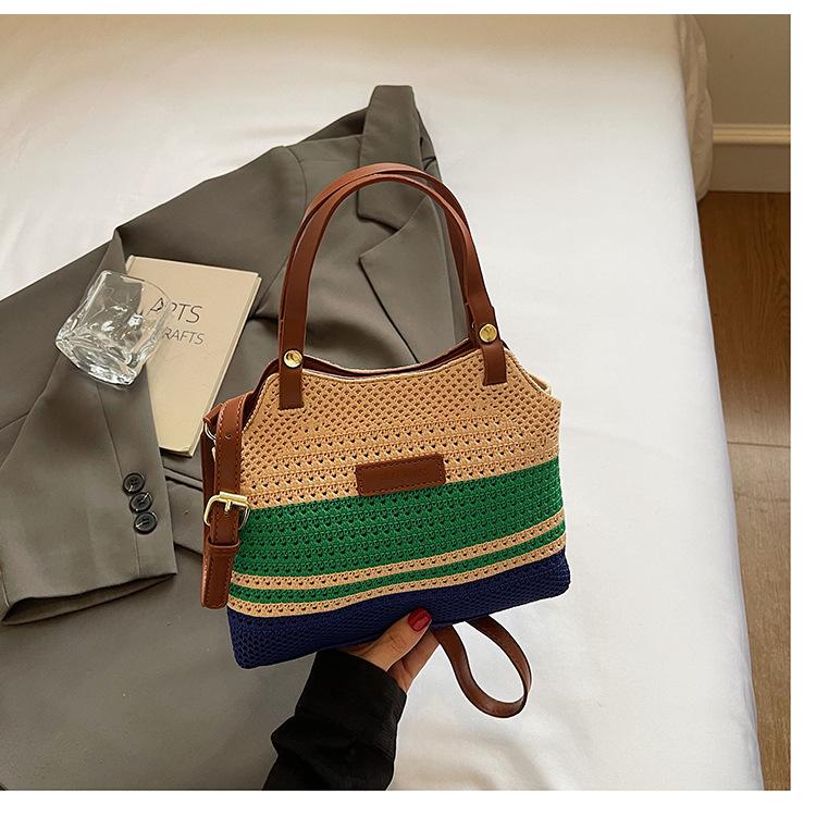 

Fashion niche hand-woven tote bag women s 2025 new seaside vacation hollow portable messenger bag tide