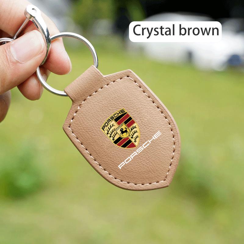 

Car Key Ring Shield Modeling Keychain Buckle Accessories For Porsche Cayenne Panamera Macan 911 718 Taycan Boxster Cayman 918 коричневий