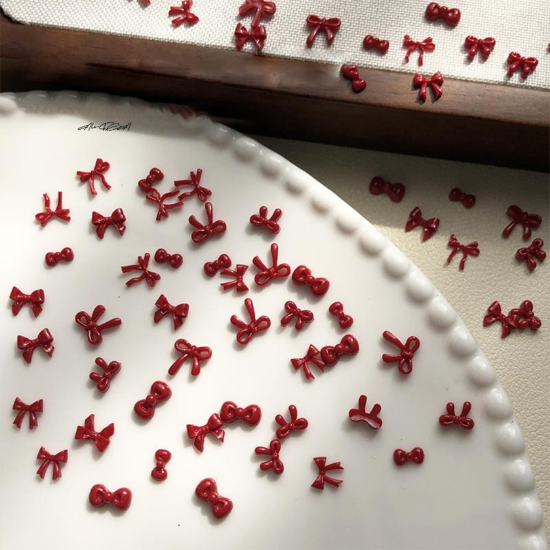 100 Stück 3D Nail Art Rote Schleifen Anhänger Kawaii Harz Zubehör für Maniküre Dekorationen 10 Stück pro Set Nail Art Zubehör