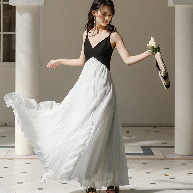 French niche retro black and white splicing irregular ruffle edge super fairy suspender dress women's vacation pleated long dress
