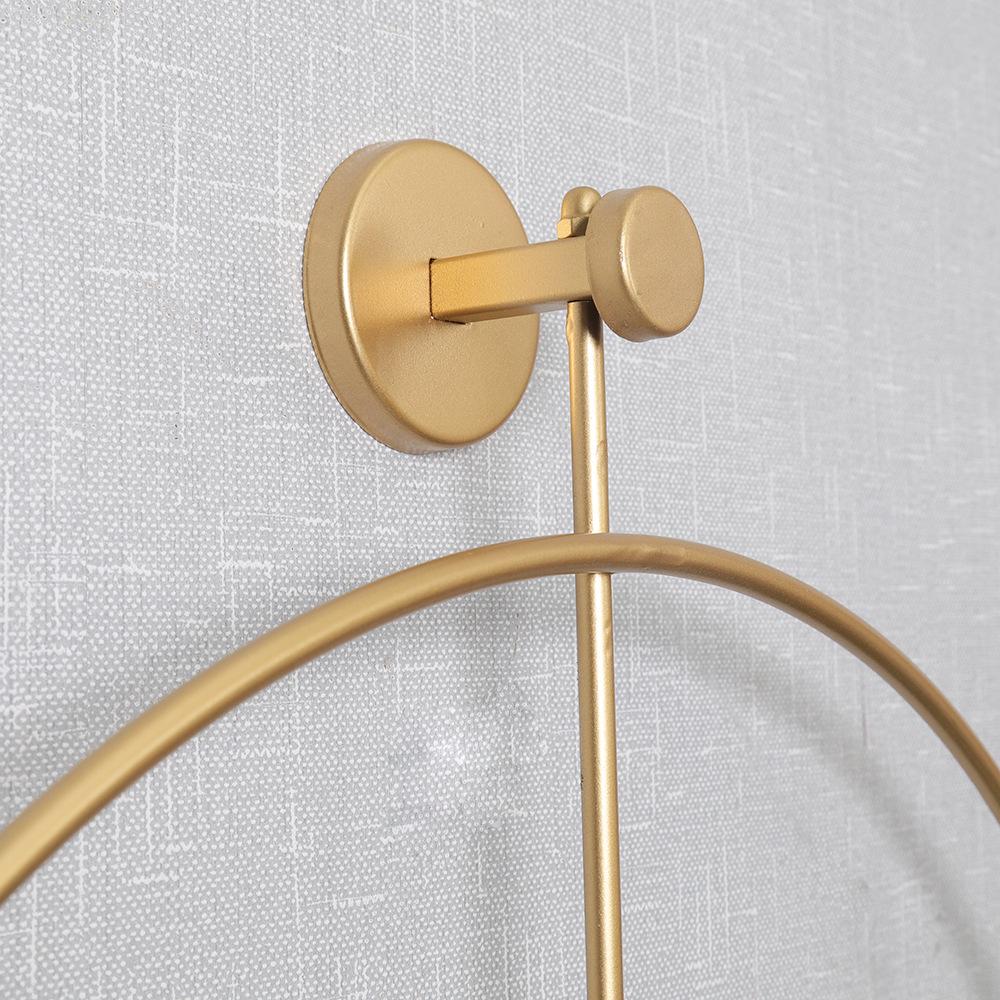 Spanische leichte, luxuriöse, schlichte Wanduhr: Kreatives Eisenring-Design mit modischer Schaukelfunktion für die Inneneinrichtung.