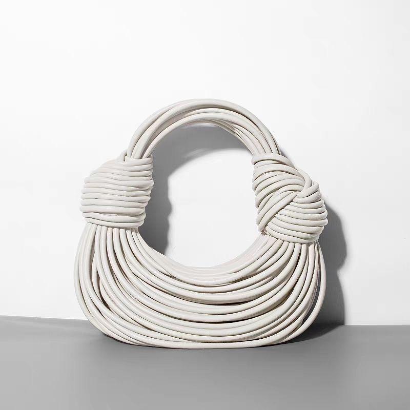 Yi Jinyuan Western-style Weaving French Circle Noodle Bag Hand-knitted Pleated Texture Niche Hand-carried Women's All-match Bag.