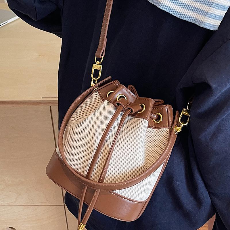 Fashion women's bags new niche high-value contrasting color shoulder messenger bag retro texture portable small bucket bag