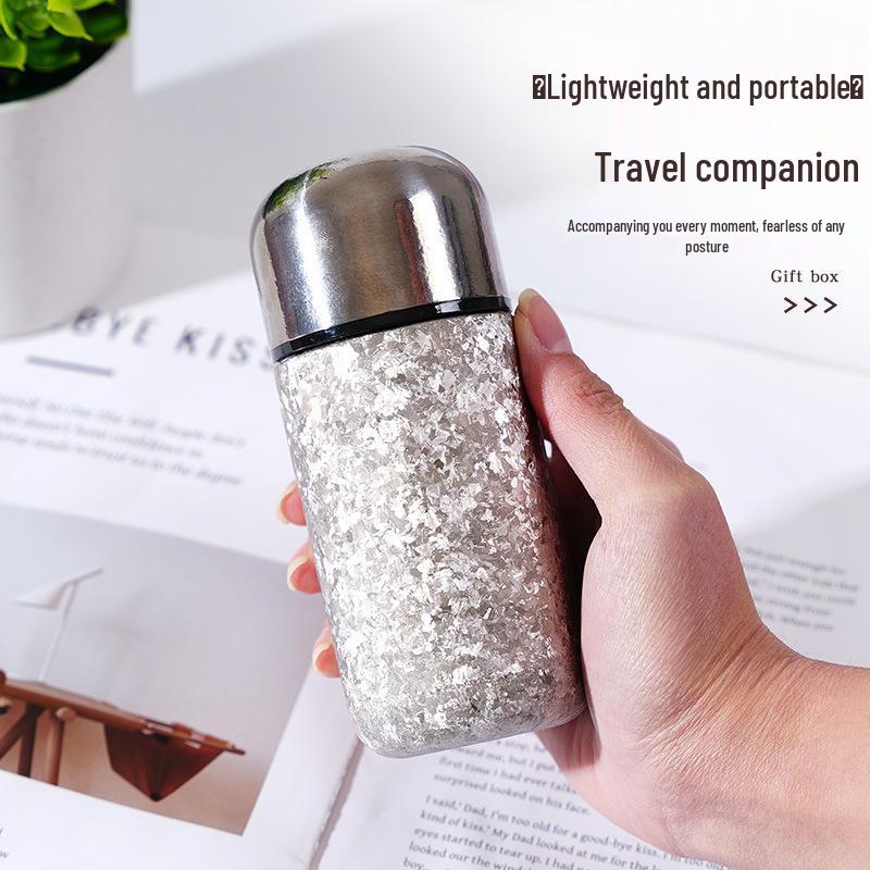 > Sleek Mini Titanium Antibacterial Double-Layer Thermos Cup - Portable, High-Value, Pocket-Sized.