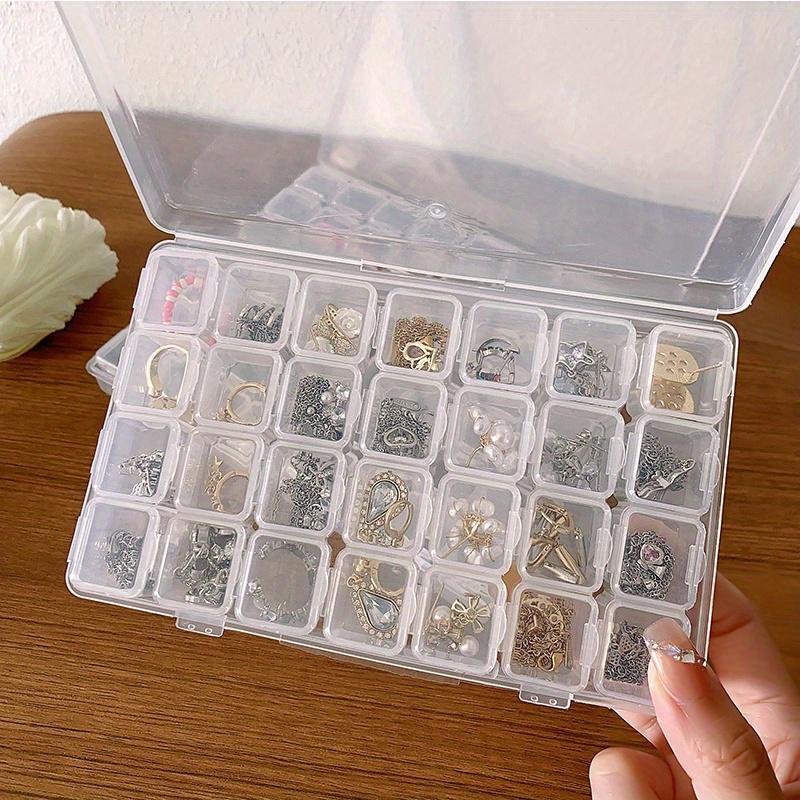 A Transparent Plastic Jewelry Box with 28/56 Compartments for Storing Earrings, Beads, and Crafts.