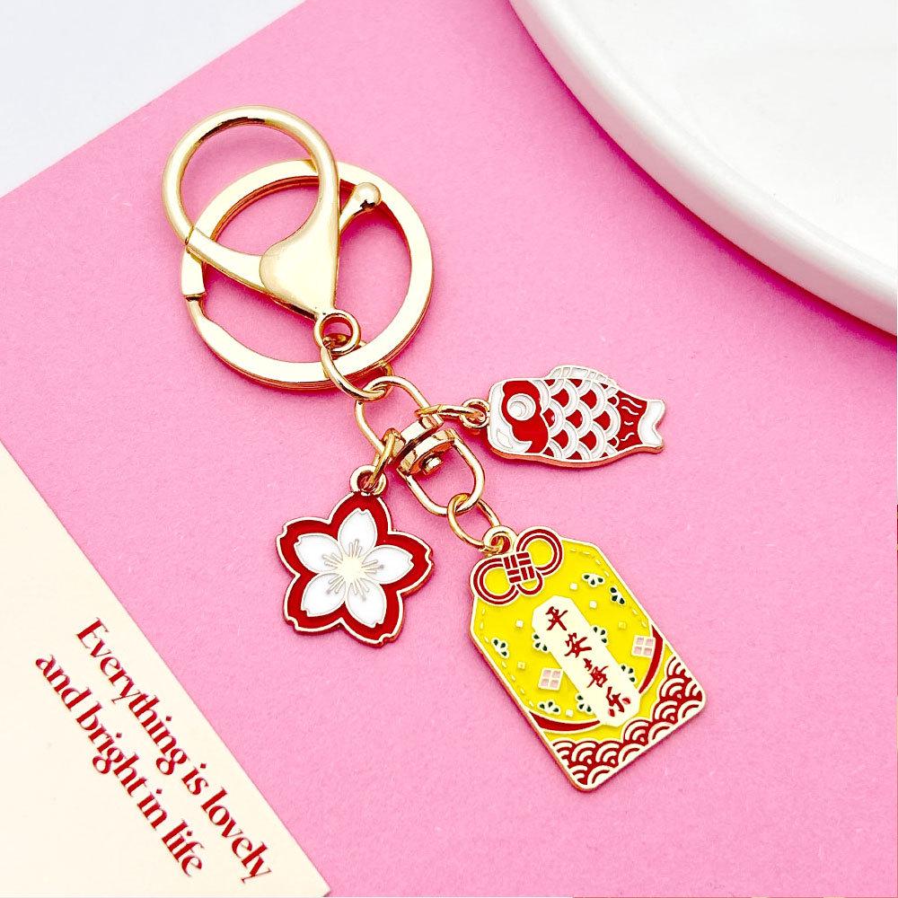 Japanese Sakura Koi Omamori Amulet Keychain for Luck, Wealth & Safety - Charming Couple's Accessory
