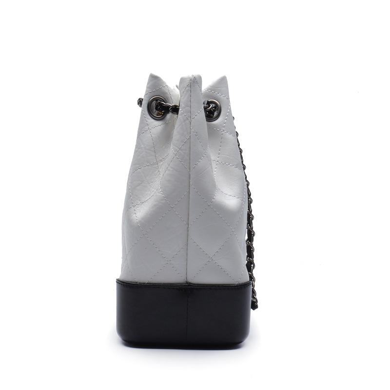 Neue koreanische Version Mode Rindsleder Rautenmuster Kette Kleiner Rucksack Einzelner Rucksack Umhängetasche Echtes Leder Eimer Damen Tasche