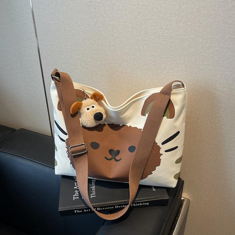 

Canvas bag women s large-capacity new summer casual shoulder bag cartoon college student class tote bag темно-коричневого