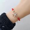 18K Rose Gold Woven "Fu" Charm Red String Bracelet for Women - Trendy and Elegant.