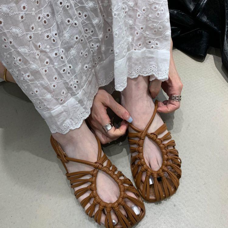 Baotou Roman sandals women's summer 2025 summer new French woven flat-bottomed pig cage shoes fairy strap soft sole