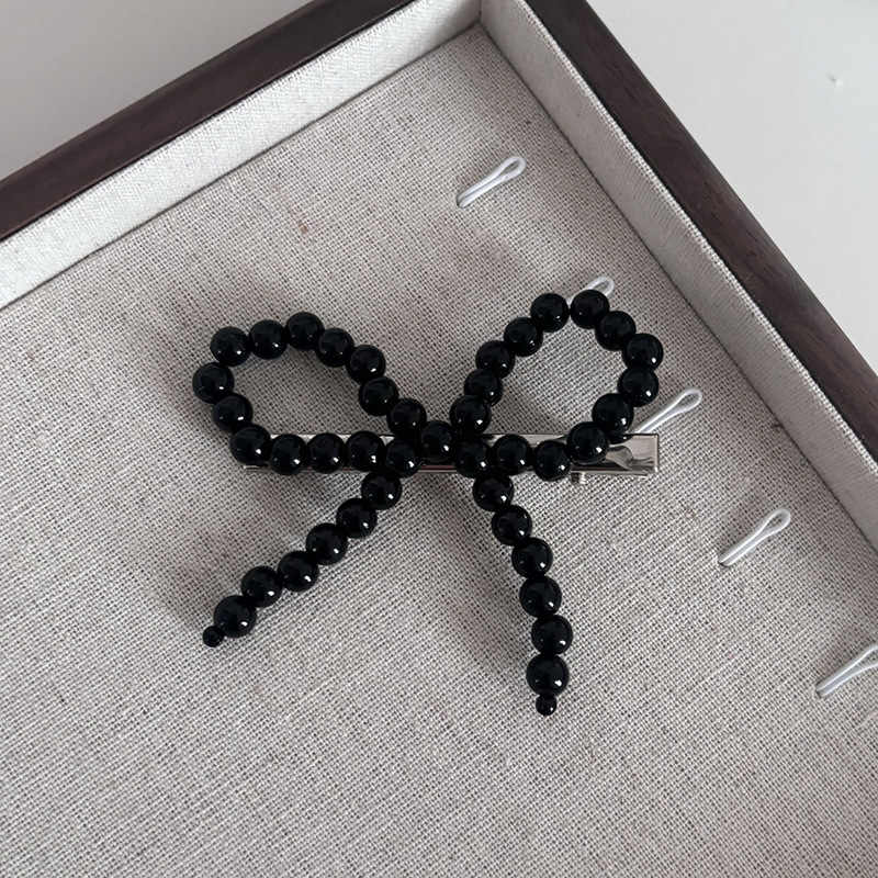 

Korean Pearl Bow Hairclips 1 pcs чорний