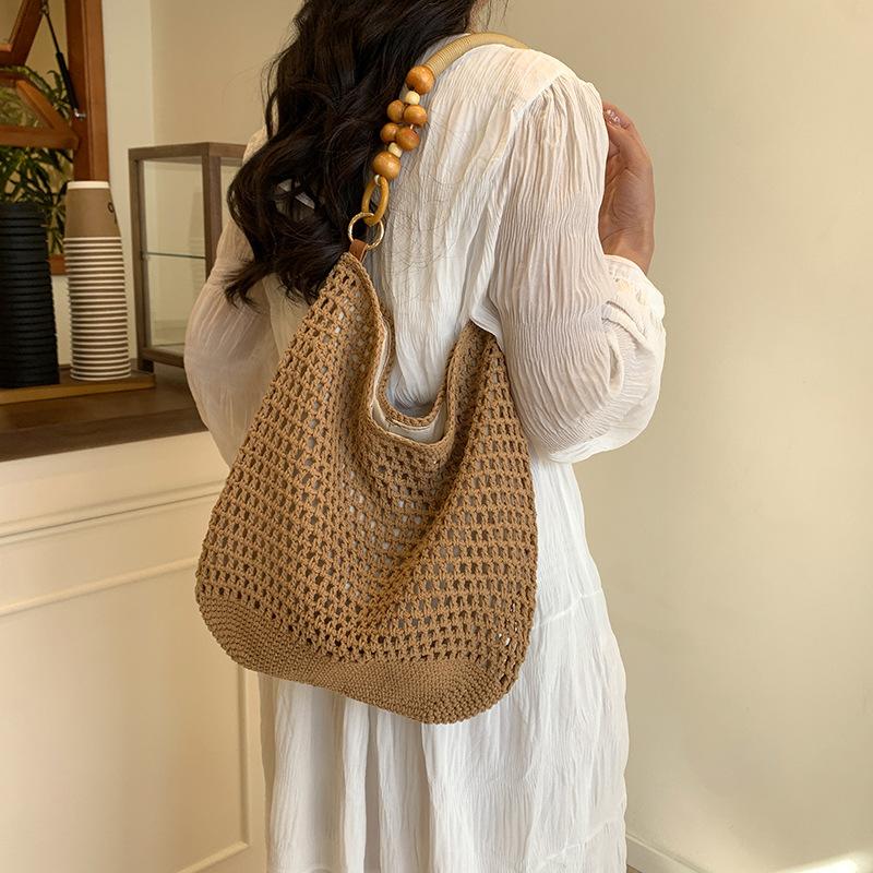 Stylish large-capacity knitted hollow women's tote bag, new exquisite beach vacation hand-woven shoulder bag
