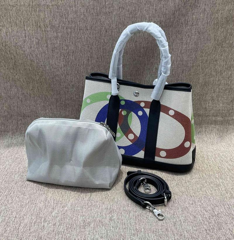 

Новая натуральная кожа верхний слой коровья кожа TOGO кожа с брезентовой садовой сумкой модная печатная сумка 30x13x21cm чёрный