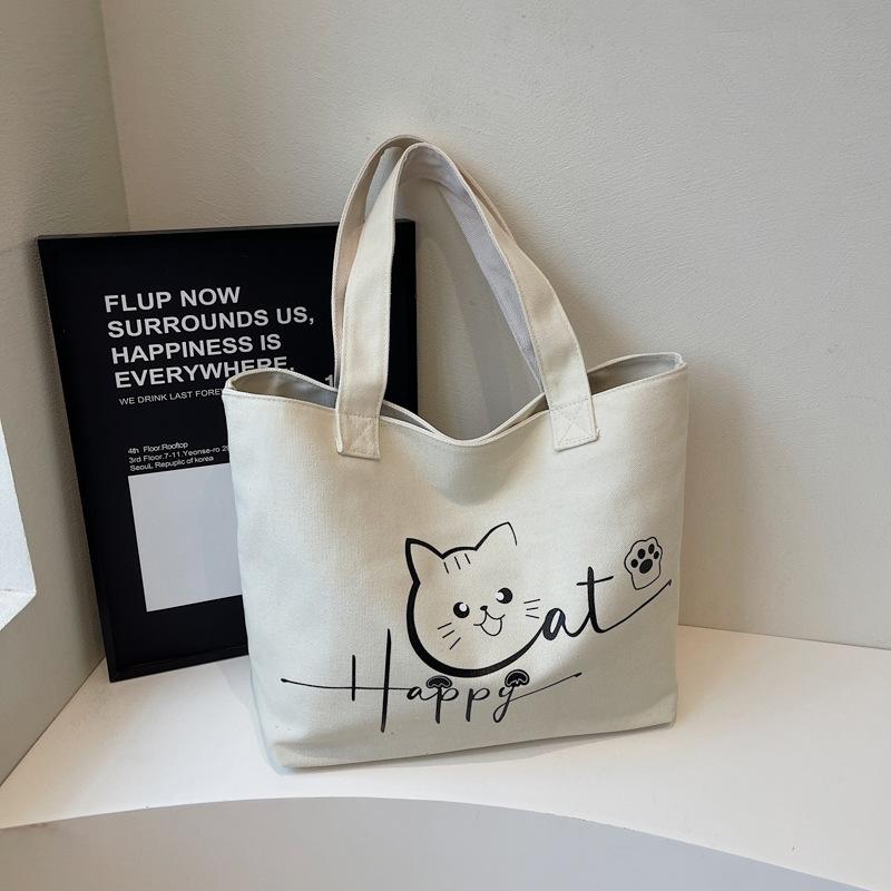 2025 Herbst neue Canvas-Tasche tragbar Schulter große Kapazität Cartoon niedlich Mode einfach Nische Tragetasche