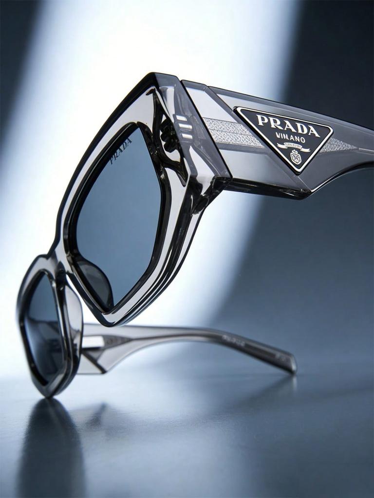 Prada PR09ZS Transparent Grey Sunglasses, Modern UV400 Shades with Triangle Logo