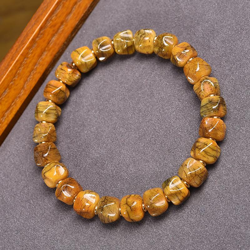 Buddhistisches Gebetsperlenarmband aus tibetischem Yakknochen und Passionsfruchtsamen