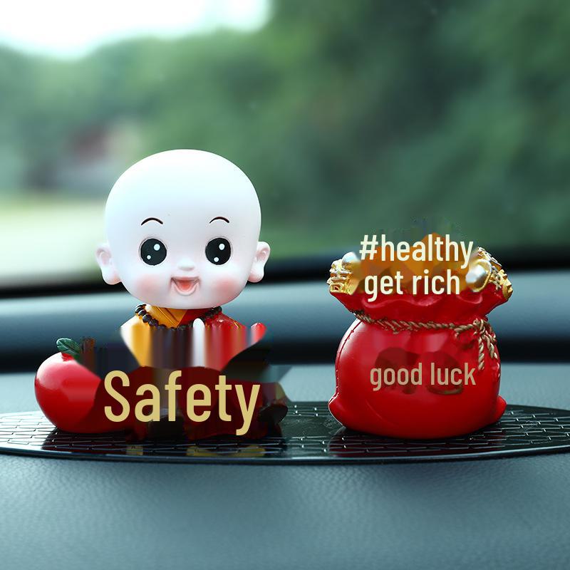 Creative Little Monk Maitreya Buddha Car Ornament: Cute, Shaking Head Resin Doll for Car Interior Decoration and Safety.